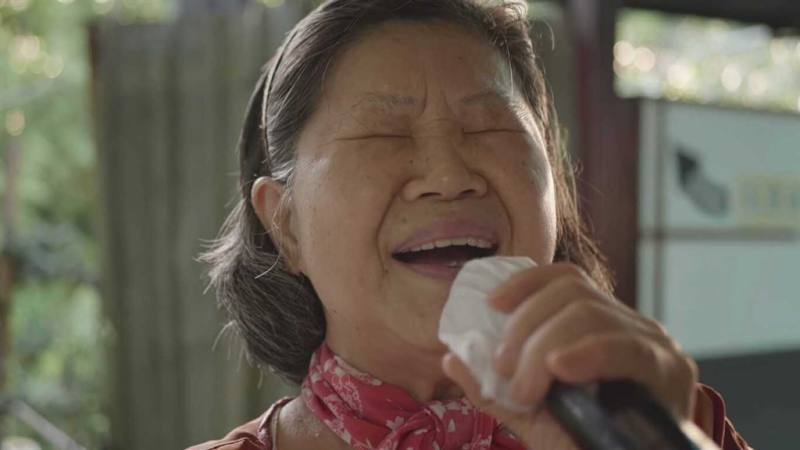 A screen grab from short film "Inner Need of Karaoke" by Czech directors Radek Ševčík and Petr Chromčák shows a woman singing karaoke. Photo courtesy of Ministry of Culture Oct. 5, 2024