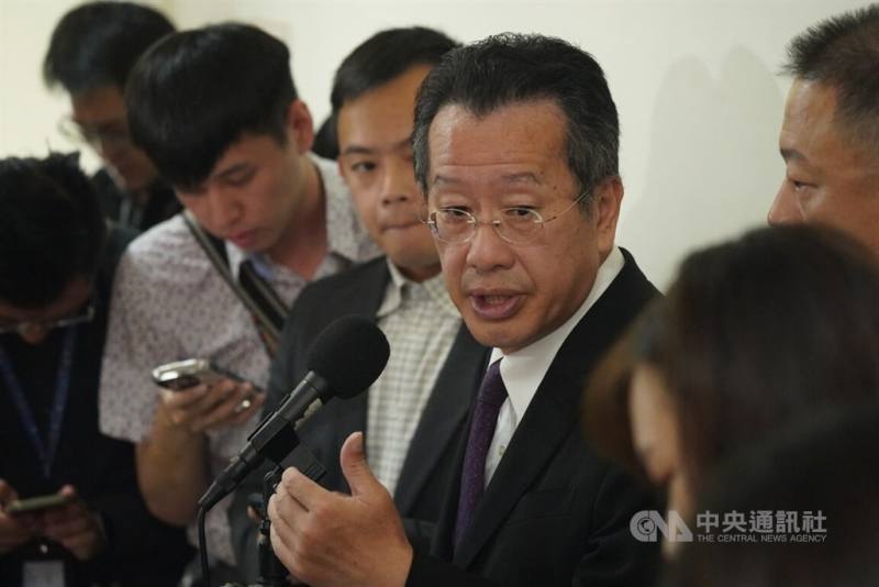 Minister of National Defense Wellington Koo (center) talks to the press at the Legislature in Taipei Monday. CNA Oct. 7, 2024