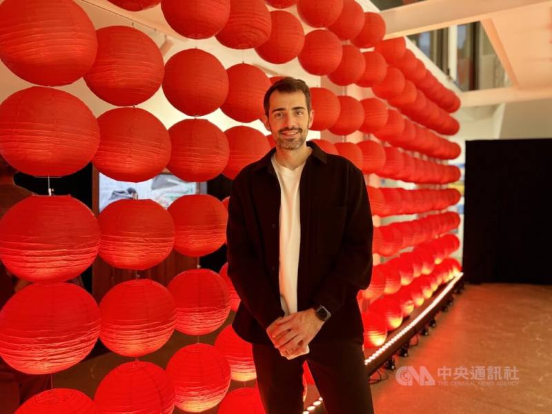 YouTuber and internet celebrity Sébastien Erson poses in front of red paper lanterns during the opening ceremony of the event on Tuesday. CNA photo Oct. 9, 2024