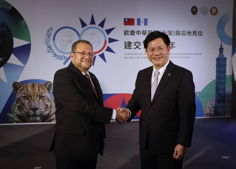 Guatemala's ambassador to Taiwan Luis Raúl Estévez López (left) and Minister of Foreign Affairs Lin Chia-lung shake hands at Sunday's celebrations in Taipei. CNA photo Dec. 22, 2024