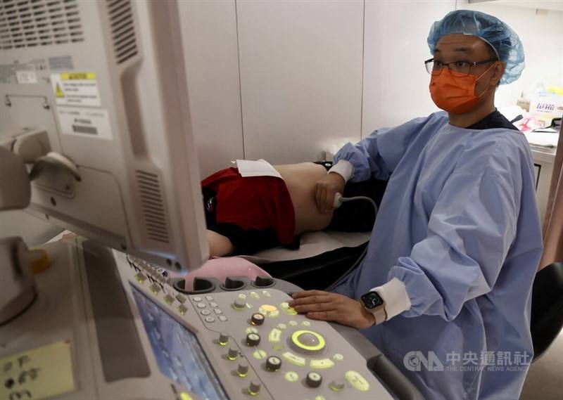 A patient receives an ultrasound from his physician in this CNA file photo