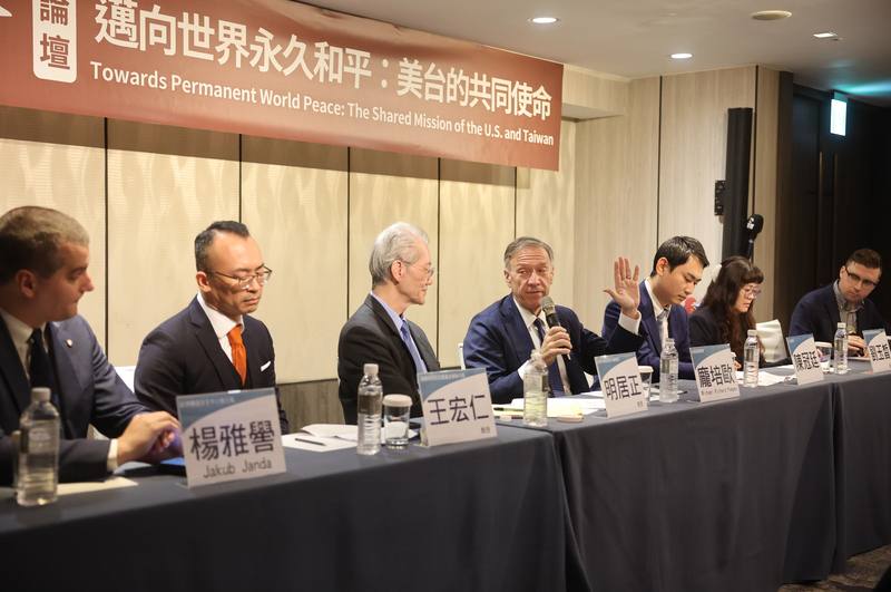 Former United States diplomat Mike Pompeo (fourth left) joins various political experts at a forum in Taipei on Monday. CNA photo Jan. 6, 2025