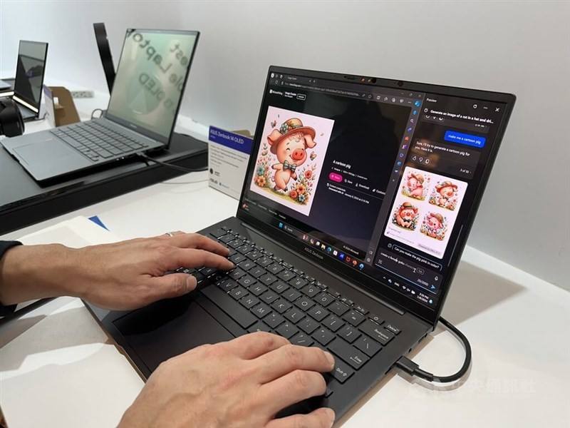 An artist edits a graphic on an laptop in this CNA file photo.