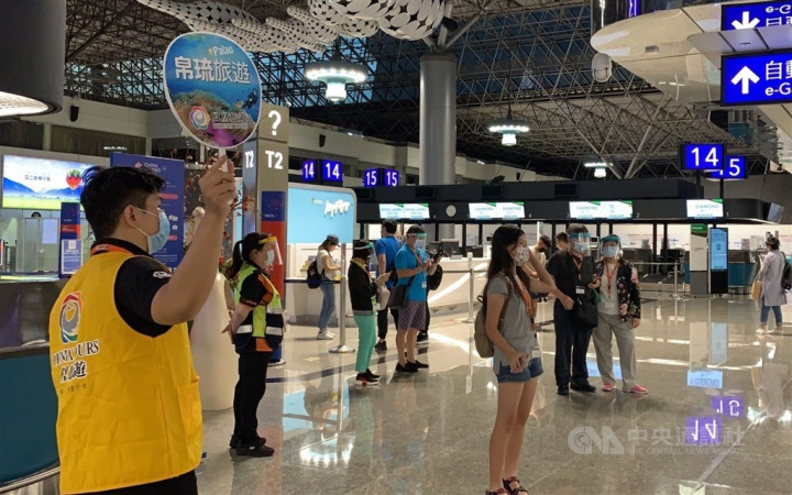 Passengers to take the flight to Palau gather in Terminal 2 of Taiwan Taoyuan International Airport Saturday morening.