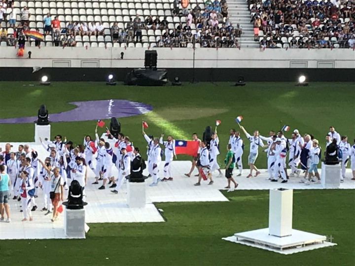 Taiwanese athletes show the Republic of China flags when attending the Gay Games in Paris in 2018.