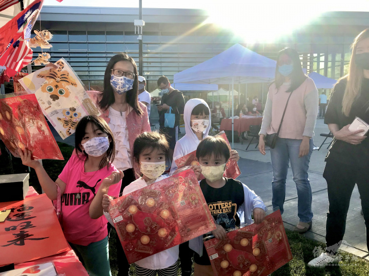 Excited event attendees with take-home lantern patterns