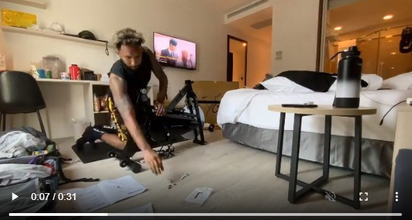 A screenshot of a video of Nino "KG" Canaleta assembling an indoor bike trainer. Taken from Nino "KG" Canaleta Instagram