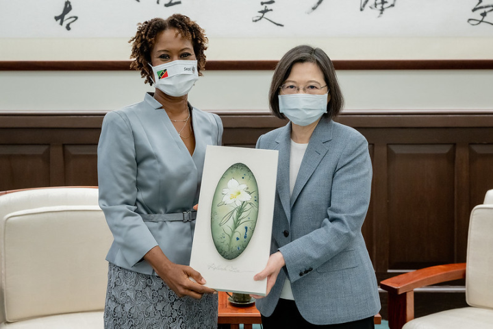 The president meets St. Christopher and Nevis Ambassador Jasmine Elise Huggins.