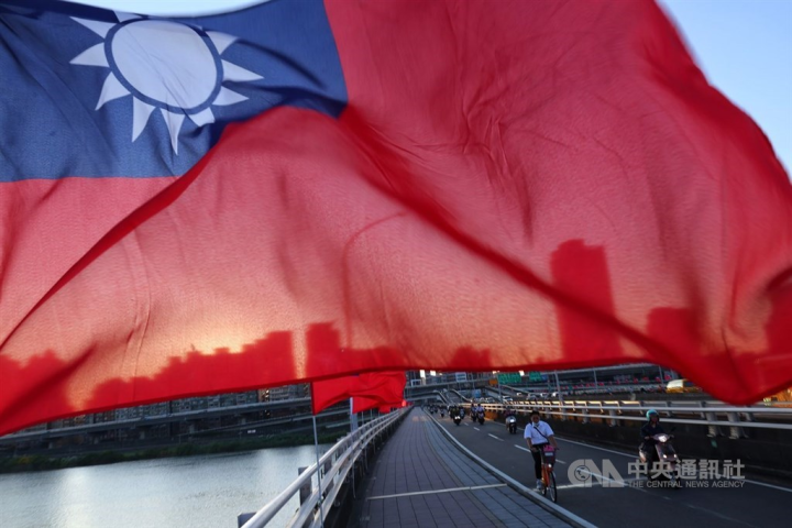 Republic of China (Taiwan) flags are hoisted on the side of a road bridge in Taipei ahead of National Day celebration on Oct. 10. 