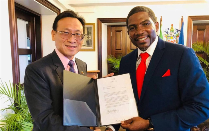 Republic of China (Taiwan) Ambassador Michael Lin (left) delivers a letter from President Tsai Ing-wen to congratulate the election of Terrance Drew as St. Kitts and Nevis' prime minister in August. File photo courtesy of ROC Embassy in St. Kitts and Nevis