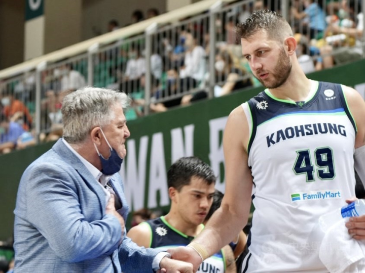 Aquas head coach Brendan Joyce (left) and Aquas center Mindaugas Kupsas celebrate the win.