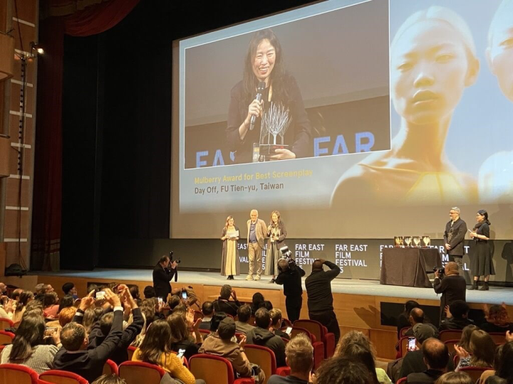 Taiwanese director of Fu Tien-yu is seen on a big screen giving her acceptance speech after she received the best screenplay award at the Udine Far East Film Festival on Saturday night. Photo courtesy of Fu Tien-yu