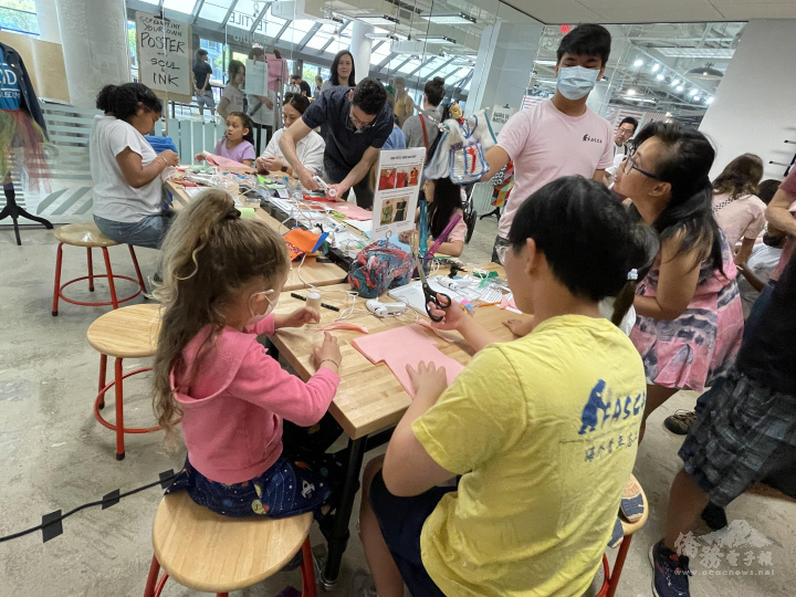 Brandon Fan Leads Volunteers in Hand Puppet Making Workshop for Kids.