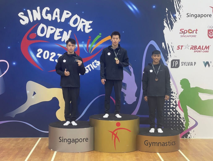 From left: Taiwanese gymnasts Shiao Yu-jan, Lee Chih-kai and Huang Yen-chang show their medals on the podium in Singapore Saturday. Photo courtesy of Lin Yu-hsin, head coach of the men's gymnastic team
