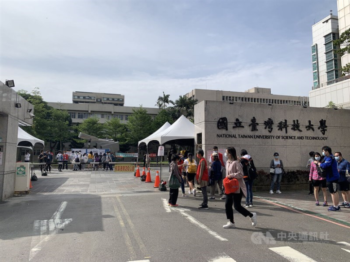 Pedestrians are seen at the gate of National Taiwan University of Science and Technology in Taipei on May 19, 2023.
