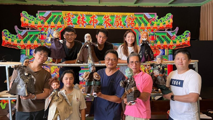 Members of the New Puppet Theatre Lab hold glove puppets in Yilan on Friday. Photo courtesy of the New Puppet Theatre Lab July 7, 2023