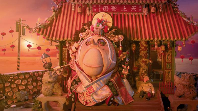 Wonderfully colorful temples and humorous images of gods are a Huang trademark. The image is from Huang’s 2018 Golden-Horse-winning short Where Am I Going?