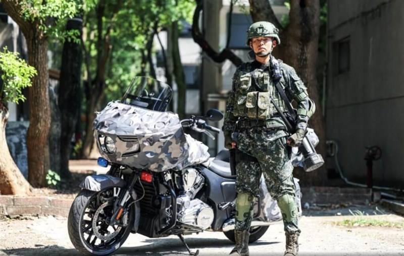 A soldier stands with the Indian Challenger motorcycle in this undated photo. Photo courtesy of Military News Agency Sept. 6, 2023