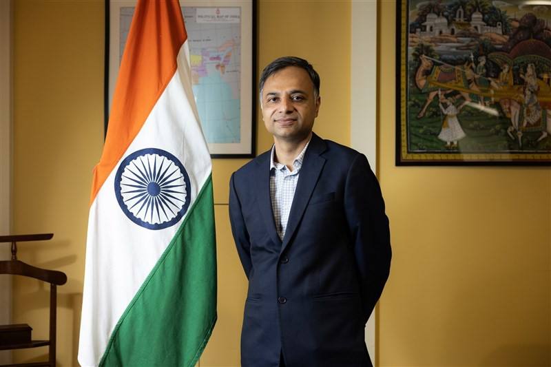 India's representative to Taiwan Manharsinh Laxmanbhai Yadav poses for a picture alongside the Indian national flag in Taipei on Monday.