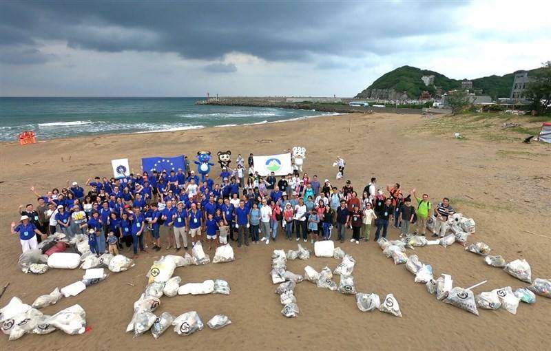 Officials of Taiwan's Ministry of Environment and representatives from various European Union entities in Taiwan launch a beach cleaning event Saturday. Photo courtesy of Climate Change Administration