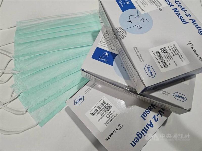 Boxes of COVID-19 rapid tests are displayed next to surgical masks in this CNA file photo