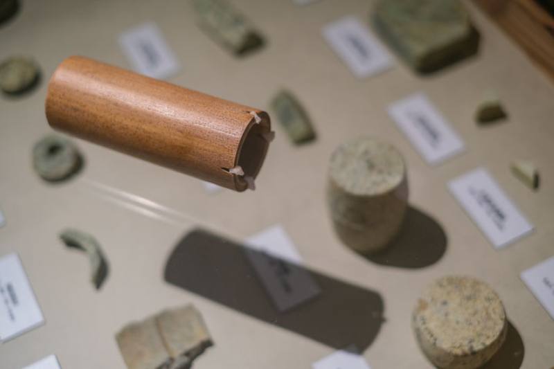 This length of bamboo with quartz teeth installed at one end is a reconstruction of a tubular saw used for creating jade pipes.
