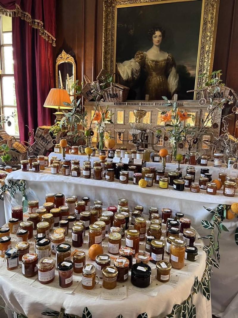 A spread of 2024 Dalemain World Marmalade Awards winning marmalades is displayed inside U.K.'s Dalemain Mansion and Historic Gardens, a UNESCO World Heritage Site. Photo courtesy of Keya Jam