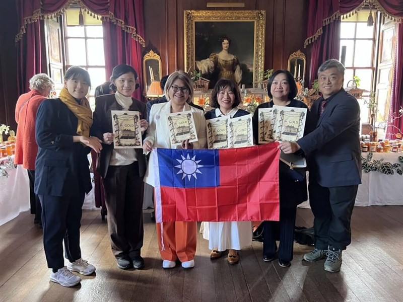 A number of Taiwanese artisanal marmalade producers pose together for a photo on Saturday at the ceremony for the 2024 Dalemain World Marmalade Awards held in the U.K.'s Dalemain Mansion and Historic Gardens. Photo courtesy of Keya Jam