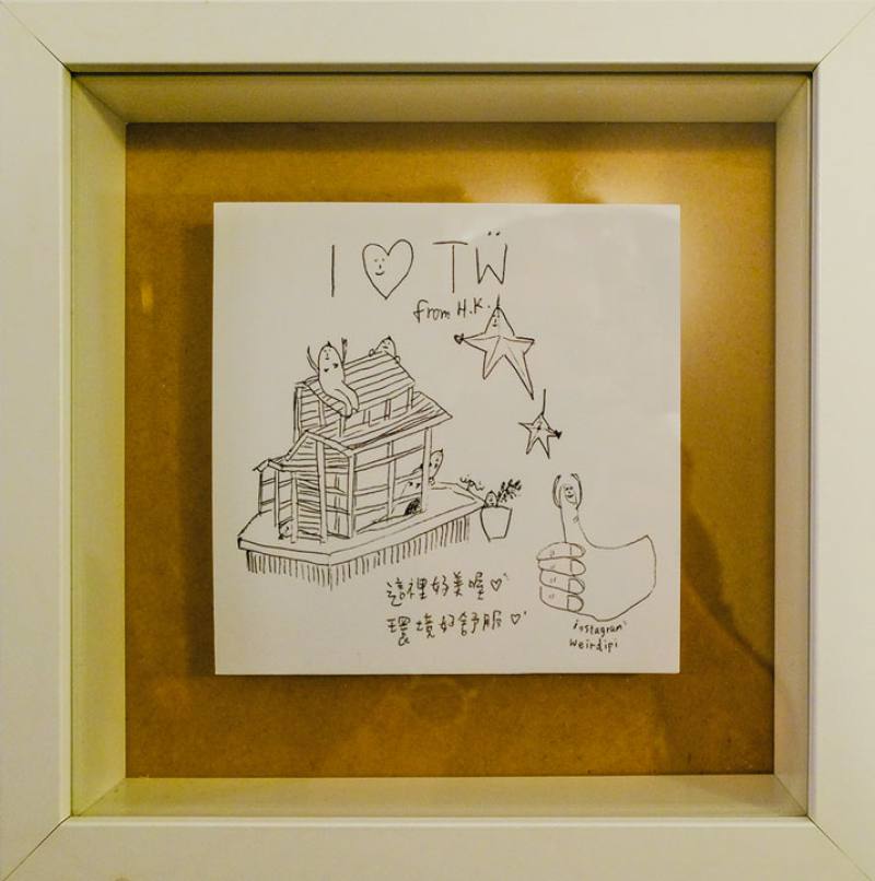 Framed sketches hanging in the common room at the Star Hostel record the appearance of the lounge as seen by travelers during their stays there.​​