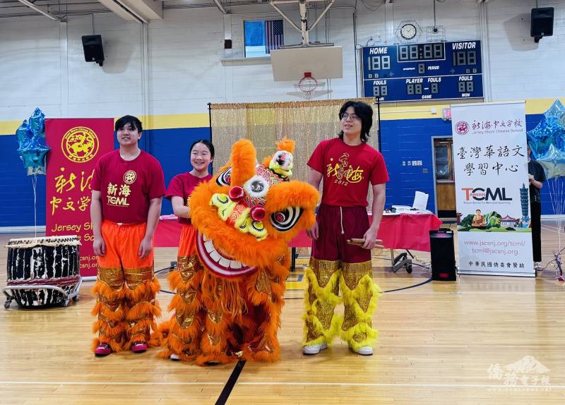 Graduate William Su (first from the right) serves as the drummer for Lion Team, delivering a spectacular performance.