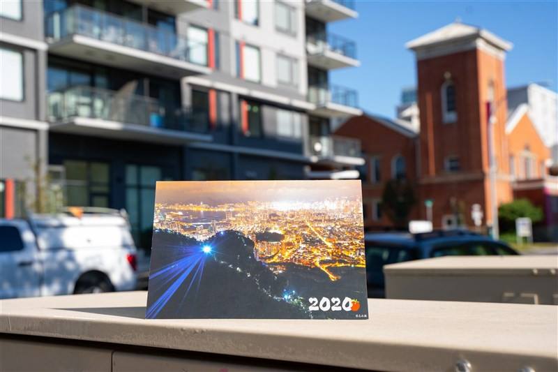 A 2020 calendar published by the Apple Daily is displayed in a neighborhood in Canada taken by Joshua on June 23, 2024.