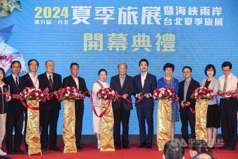 Straits Exchange Foundation Vice Chairman and Secretary-General Luo Wen-jia (third right) attends the opening ceremony of the Summer Travel Expo in Taipei Friday. CNA photo July 12, 2024