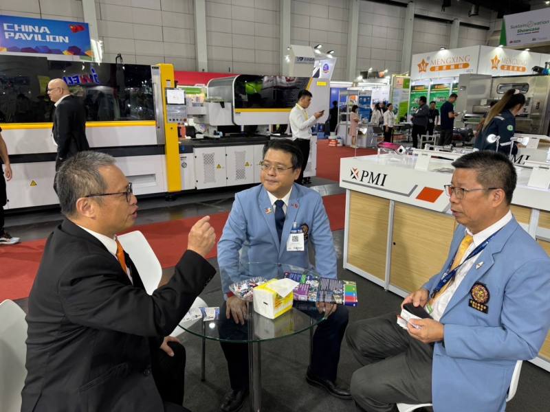 The Precision Motion Industries Inc., a company in the park, is conducting booth matchmaking negotiations.