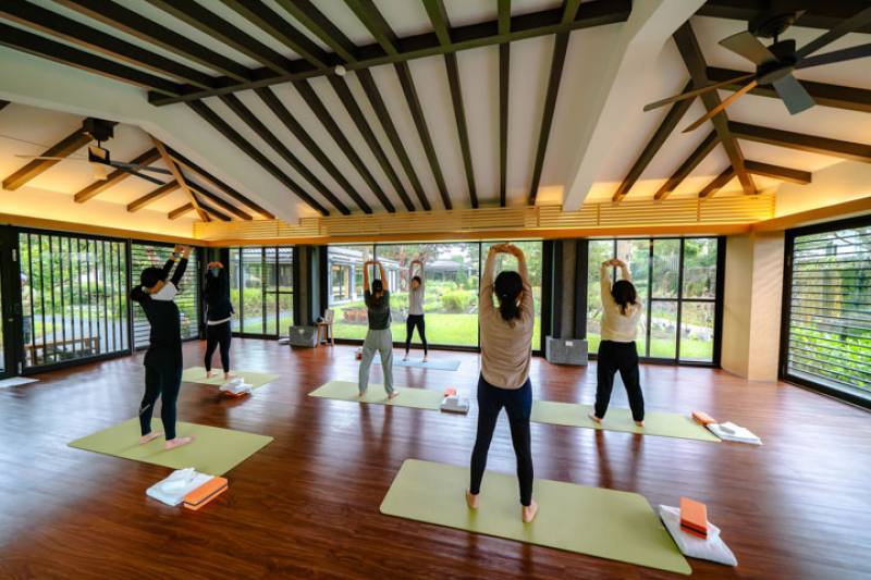 Gaeavilla Resort offers yoga and other wellness classes. Stretching out in front of verdant surroundings is really a pleasure. (photo by Lin Min-hsuan)​​