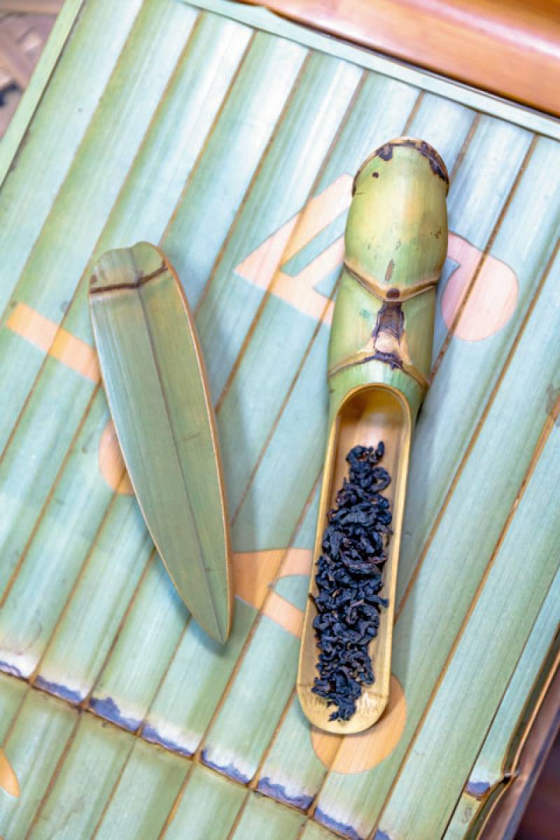 Tea scoops with the green of the bamboo preserved through a chemical process. Made of square bamboo (Chimonobambusa quadrangularis), the cicada-shaped scoop (left) won a Good Craft Award from the National Taiwan Craft Research and Development Institute.​​