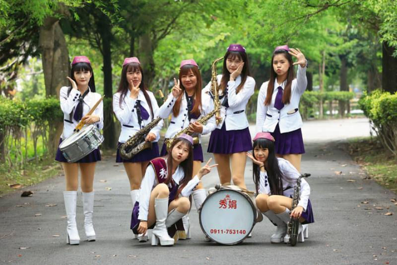 Guo Shujuan (rear, center) founded the Xiujuan Women’s Band. She hopes that young people can see a future for xiyuedui and that her group may perform overseas someday.