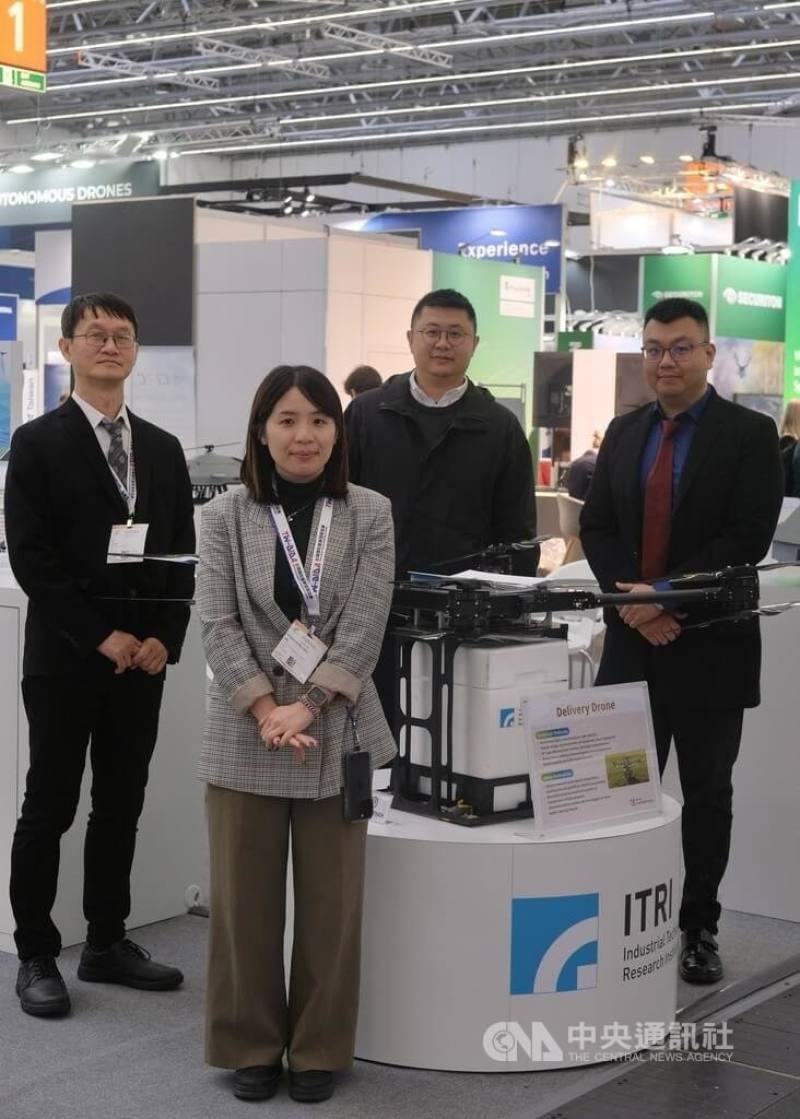 Members of the ITRI pose with a delivery drone. CNA photo Feb. 21, 2025