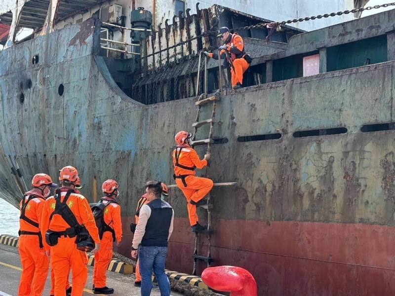 Coast guard officers board the Togolese-registered vessel on Tuesday. Photo courtesy of the Coast Guard Administration.