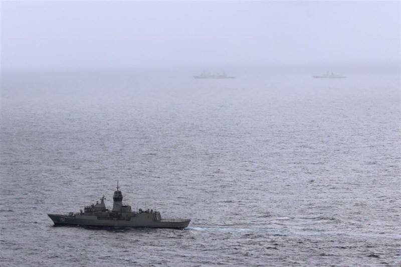 In this photo provided by the Australian Defense Force, the HMAS (His Majesty’s Australian Ship) Arunta, left, shadows the People’s Liberation Army-Navy Jiangkai-class frigate Hengyang and a Fuchi-class replenishment vessel in the Tasman Sea, on Feb. 13, 