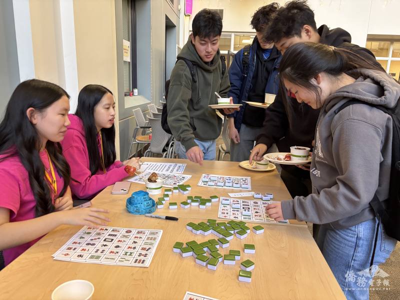 Students play bingo with mahjong, a traditional Taiwanese game.