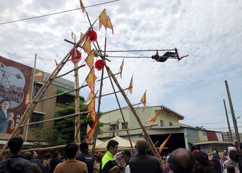 A traditional high swing festival takes place in front of a Taoist temple in southern Taiwan's Chiayi City on Sunday. CNA photo March 30, 2025