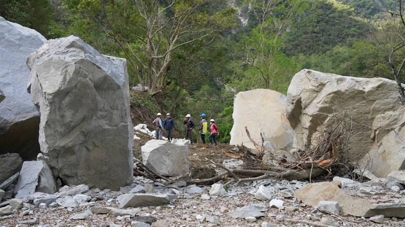 Reconstruction workers stand among large boulders in Hualien County's Taroko area, which were dislodged by a massive earthquake a year ago. Photo courtesy of the Ministry of the Interior April 3, 2025