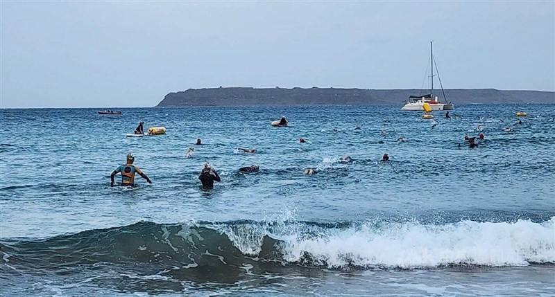 Triathletes brave the rough Penghu County seas on Sunday while participating in Ironman Taiwan triathlon. CNA photo April 13, 2025