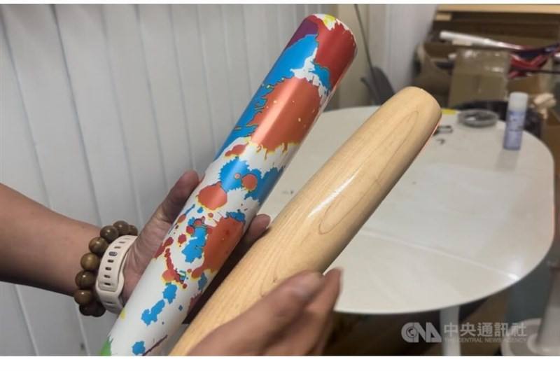 A torpedo bat (right) is compared to a regular-shaped bat in this CNA file photo