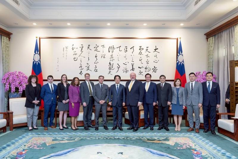 President Lai poses for a photo with a delegation from the National Bureau of Asian Research.
