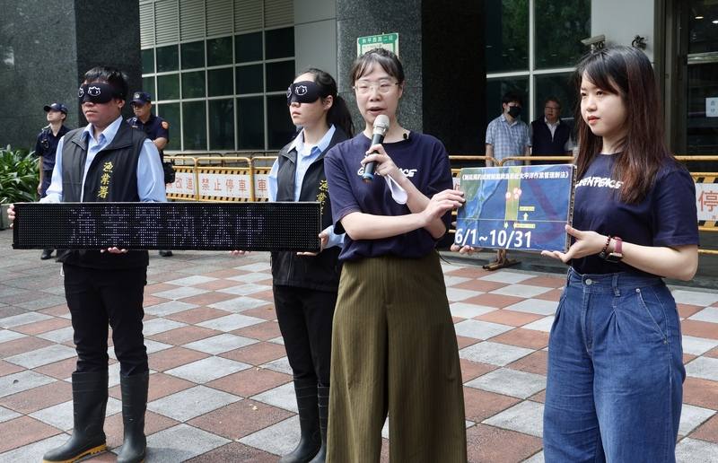 Huang Hsin-yi, marine project director at Greenpeace (front, second from right), joins protesters accusing Taiwan-flagged vessels of illegally catching sharks last year in a closed area of the North Pacific Ocean. CNA photo May 6, 2025