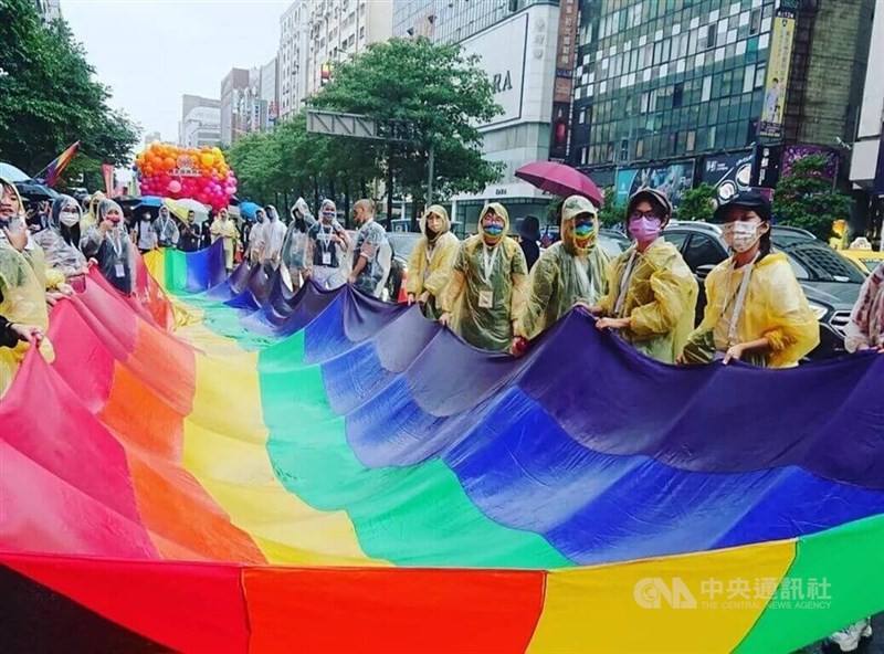 Members of Taiwan's LGBTQ community and allies display a rainbow flag, a symbol of the community, during a Pride Parade in this CNA file photo
