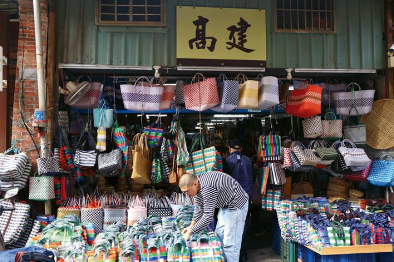 Under a street portico full of goods, with shoppers milling about, the past prosperity of once thriving commercial communities seems to have returned.​​