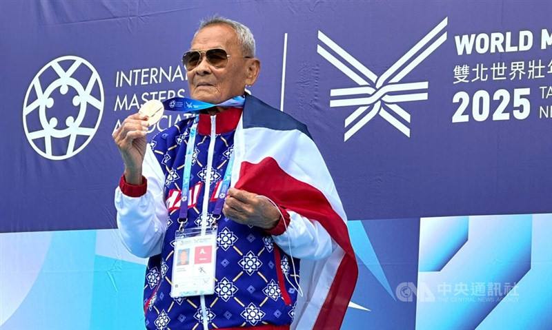 Thailand's Sawang Janpram, the oldest competitor at the 2025 World Masters Games at 105 years old, shows off a gold medal he won on Sunday for the 100+ age group. CNA photo May 18, 2025