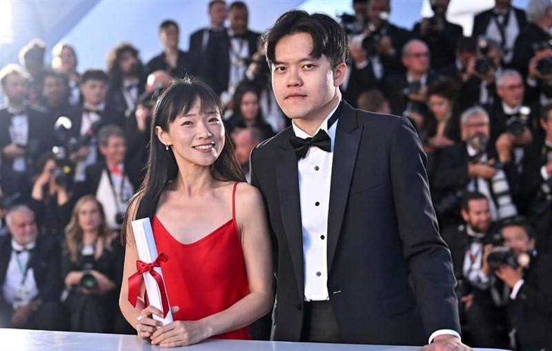 Chiang Wei-liang (front, right) and Yin You-qiao (front, left), directors of the film "Mongrel," pose for a photo at the 2024 Cannes Film Festival. Photo courtesy of Activator Co.